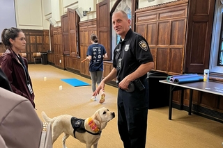 Officer with Heidi, Yale's Therapy dog