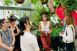 Tour guide teaching postdocs at the Marsh Botanical Garden tour