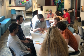 YPA members playing a board game at game night